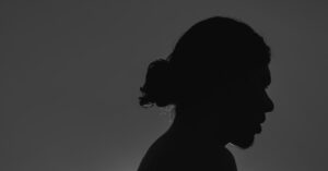 a silhouette of a person in the dark