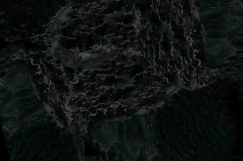 a black and white photo of a rock formation